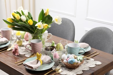 Photo of Festive table setting with beautiful flowers. Easter celebration