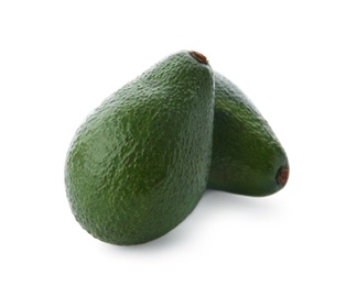 Photo of Ripe avocados on white background. Tropical fruit