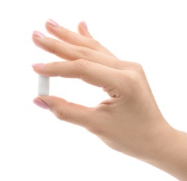 Photo of Woman holding chewing gum piece on white background, closeup