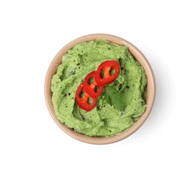 Photo of Bowl of delicious guacamole with chili pepper isolated on white, top view