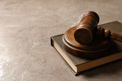 Wooden gavel and book on table. Law concept