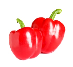 Photo of Tasty ripe red bell peppers on white background
