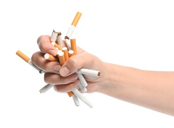Photo of Stop smoking. Man holding broken cigarettes on white background, closeup
