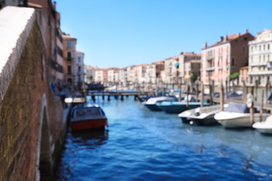 Photo of VENICE, ITALY - JUNE 13, 2019: Blurred view of Grand Canal with boats at pier