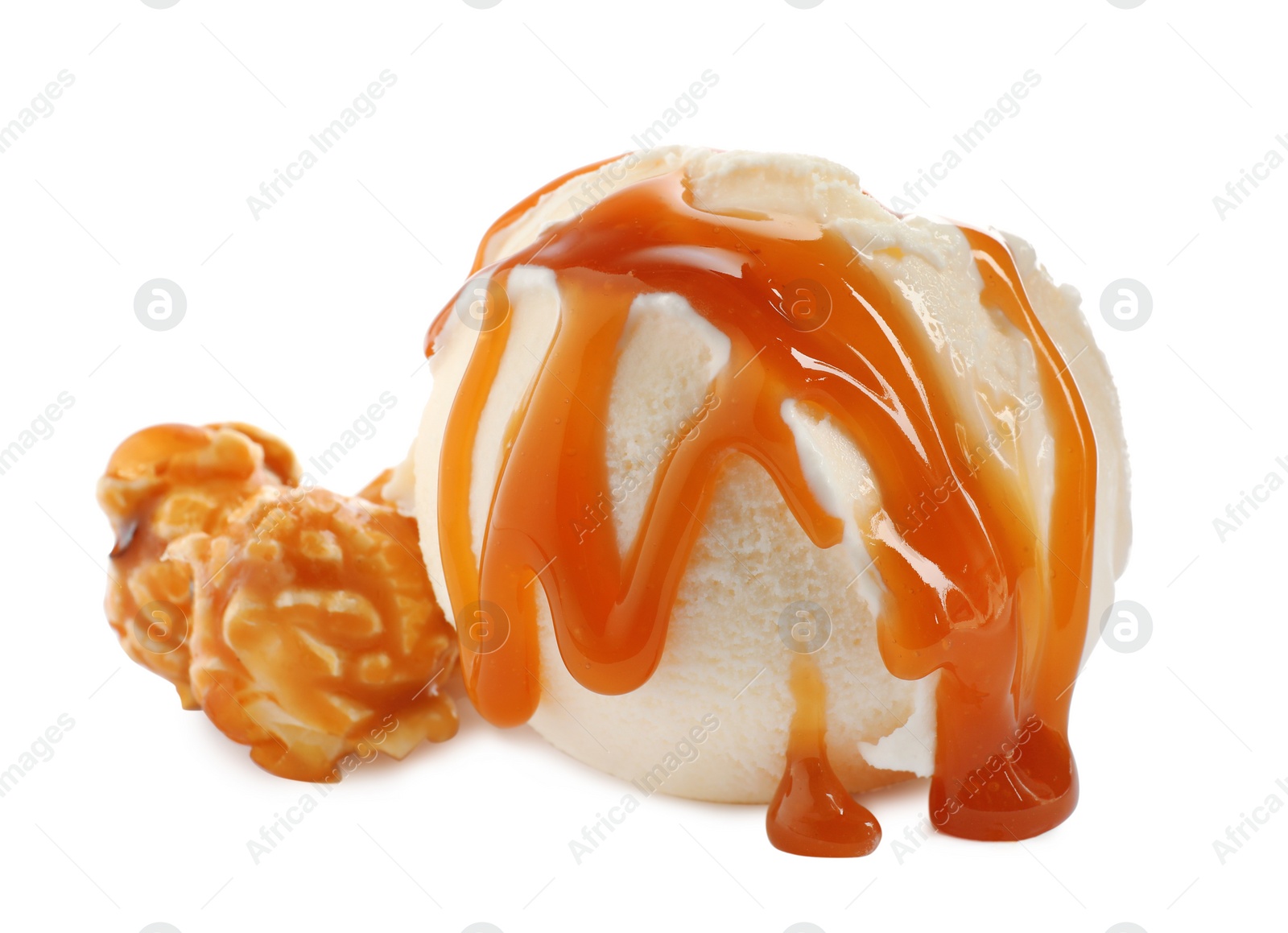 Photo of Scoop of delicious ice cream with caramel sauce and popcorn on white background