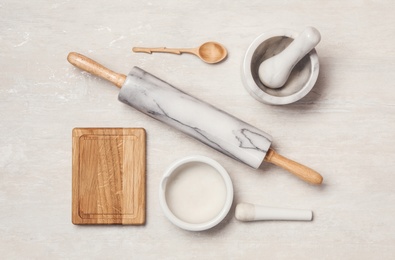 Photo of Set of cooking utensils on white table, flat lay