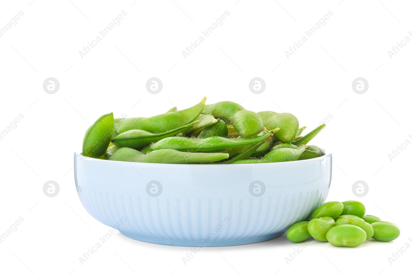 Photo of Bowl with green edamame pods and beans on white background