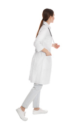 Doctor with stethoscope walking on white background
