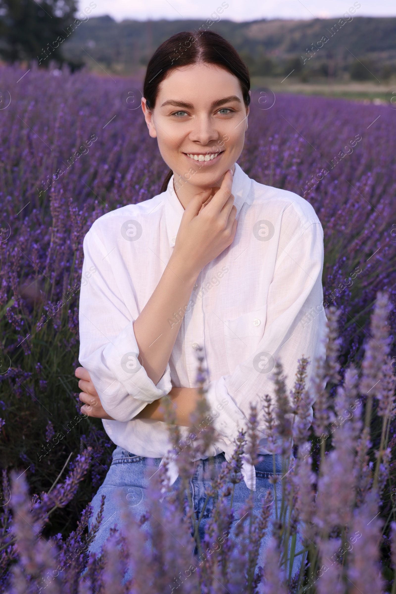 Photo of Portrait of smiling woman in lavender field