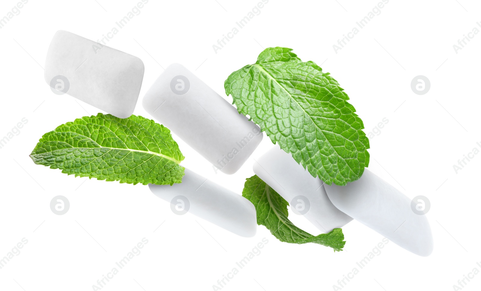 Image of Fresh mint leaves and chewing gum pads falling on white background