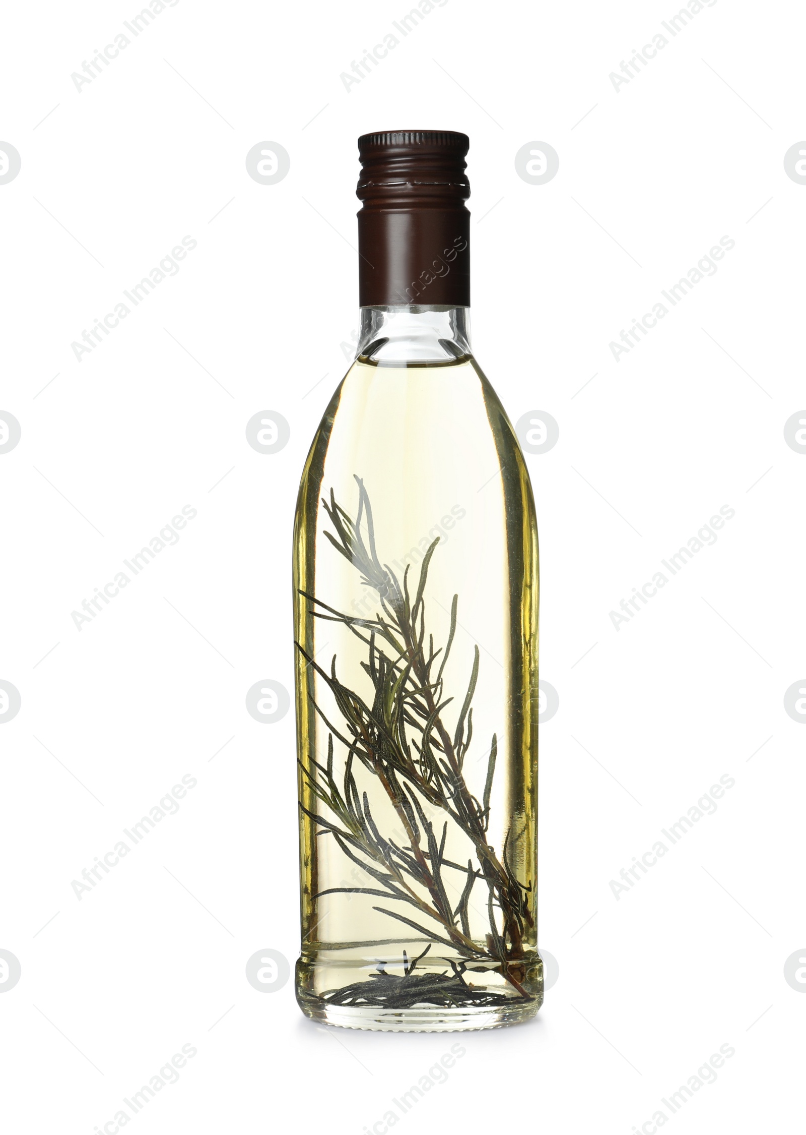 Photo of Cooking oil with rosemary in glass bottle isolated on white