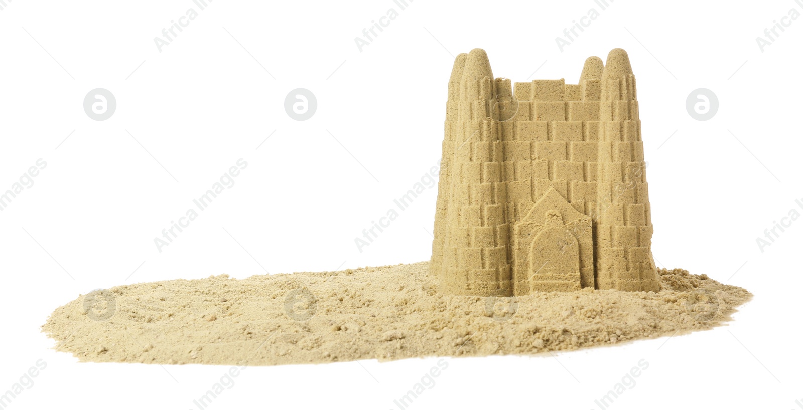 Photo of Pile of sand with beautiful castle isolated on white