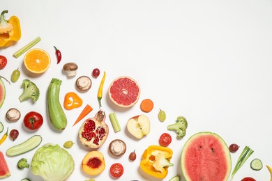 Photo of Fresh organic fruits and vegetables on white background, flat lay. Space for text