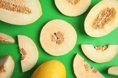 Photo of Flat lay composition with cut melon on color background