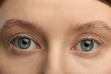 Photo of Woman with beautiful natural eyelashes, closeup view