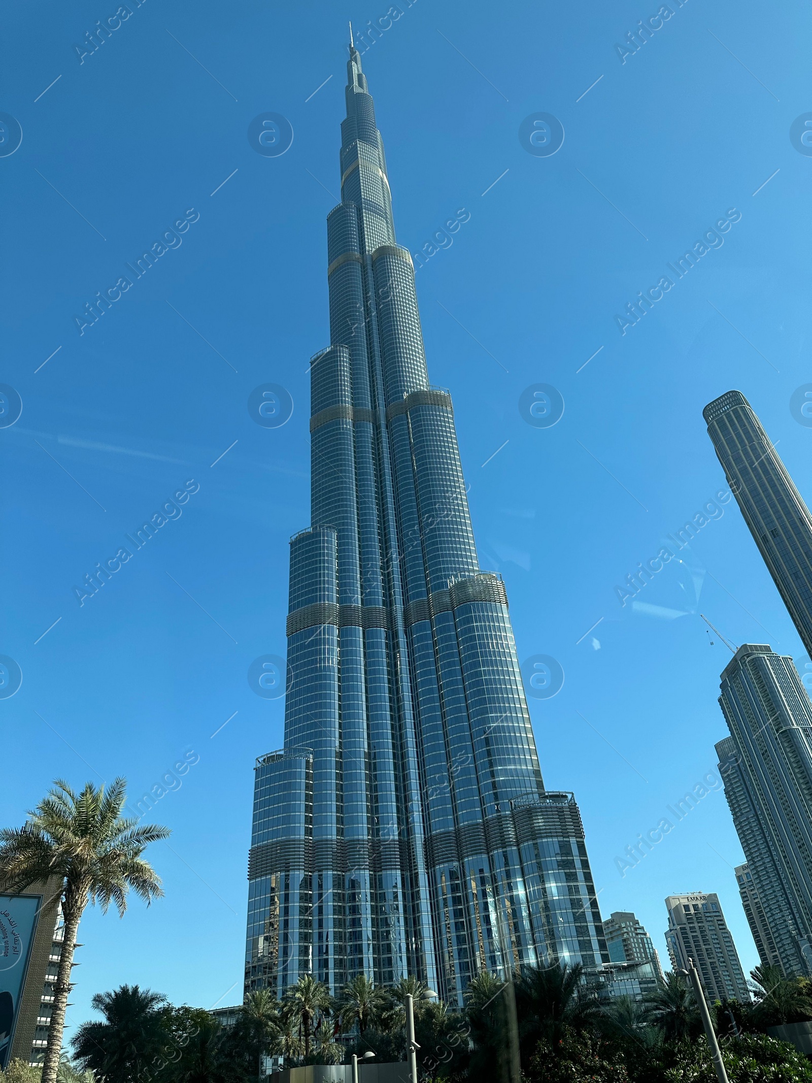 Photo of Dubai, United Arab Emirates - May 2, 2023: Beautiful view of Burj Khalifa in city under blue sky