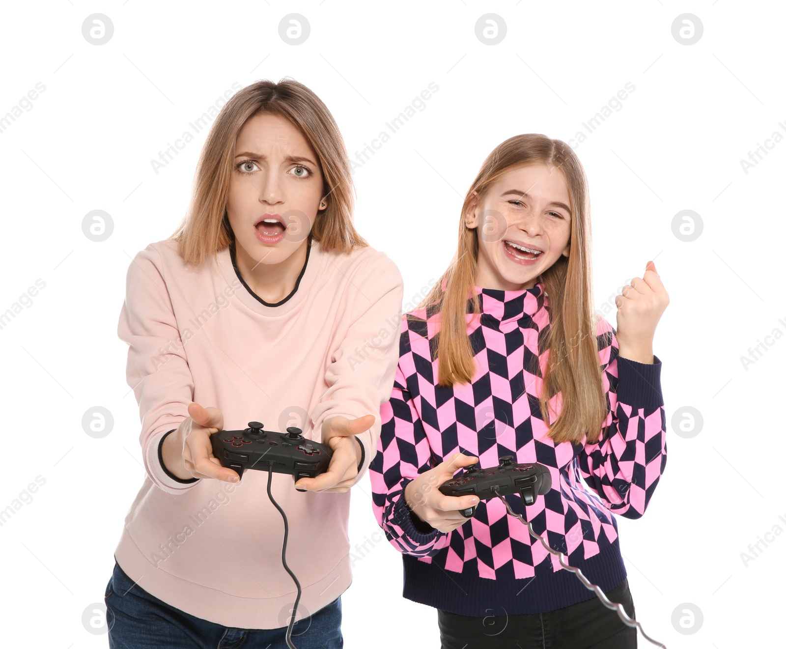 Photo of Young woman and teenage girl playing video games with controllers isolated on white