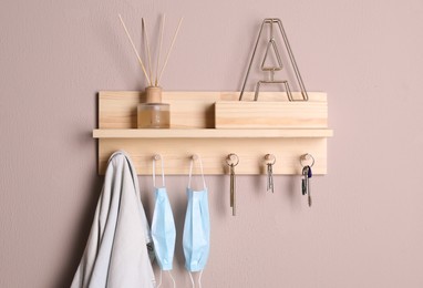 Wooden hanger for keys on color wall