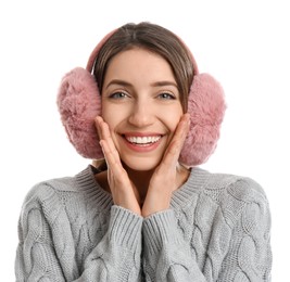 Photo of Happy woman wearing warm earmuffs on white background