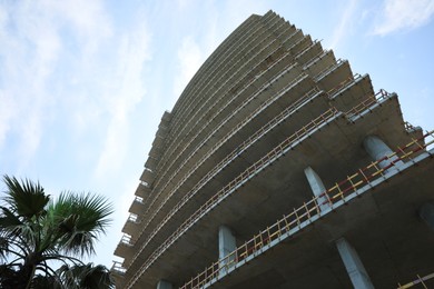 Construction site with unfinished building, low angle view