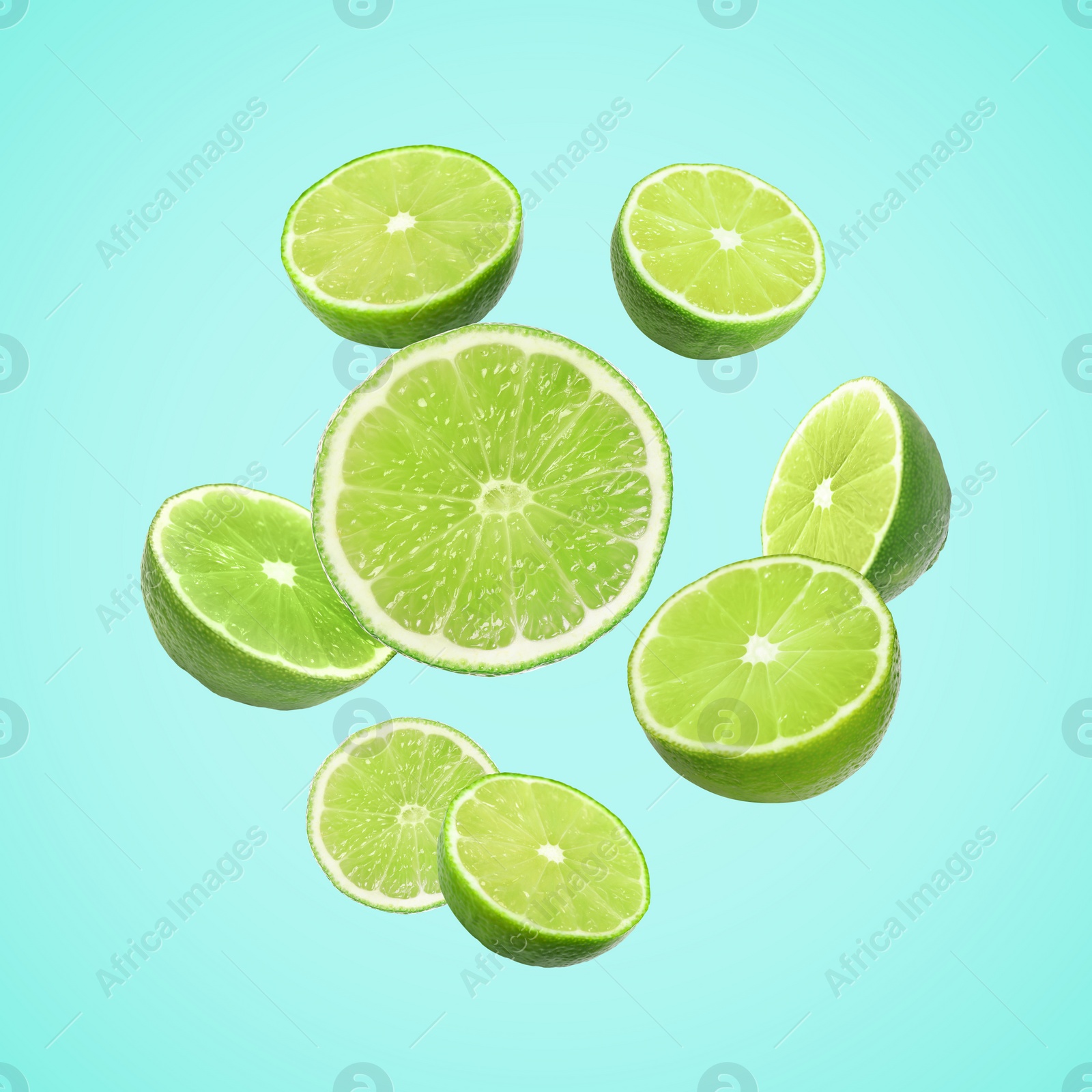 Image of Fresh lime fruits falling on light blue background