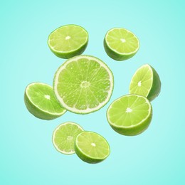 Image of Fresh lime fruits falling on light blue background