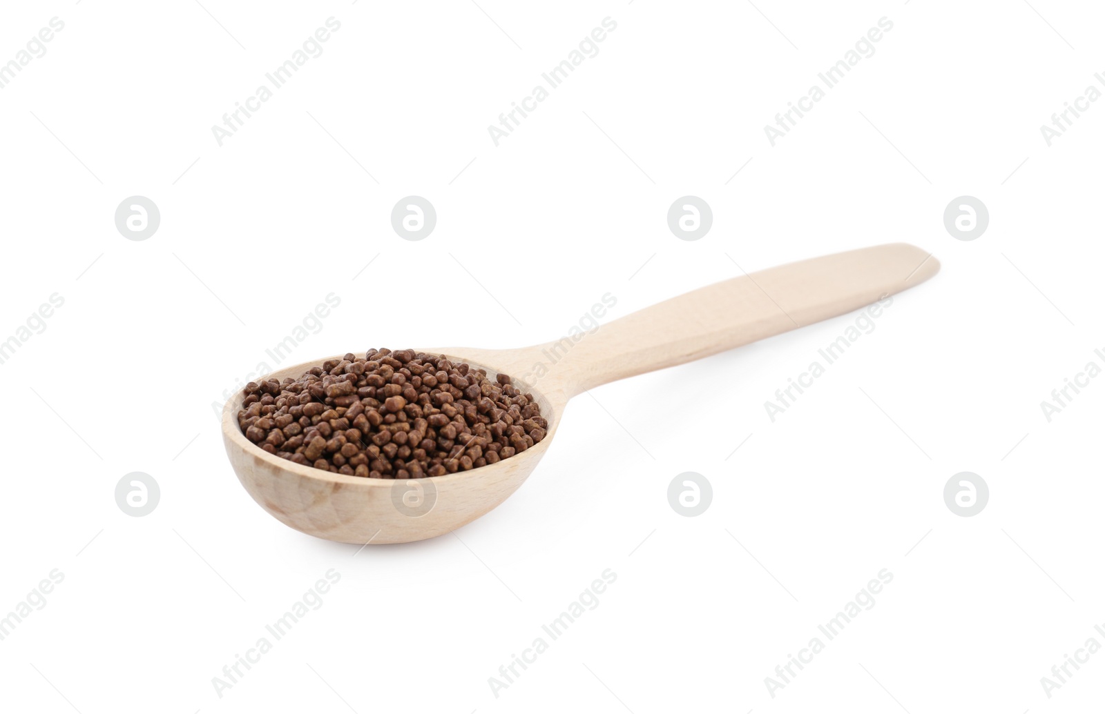 Photo of Wooden spoon with buckwheat tea granules on white background