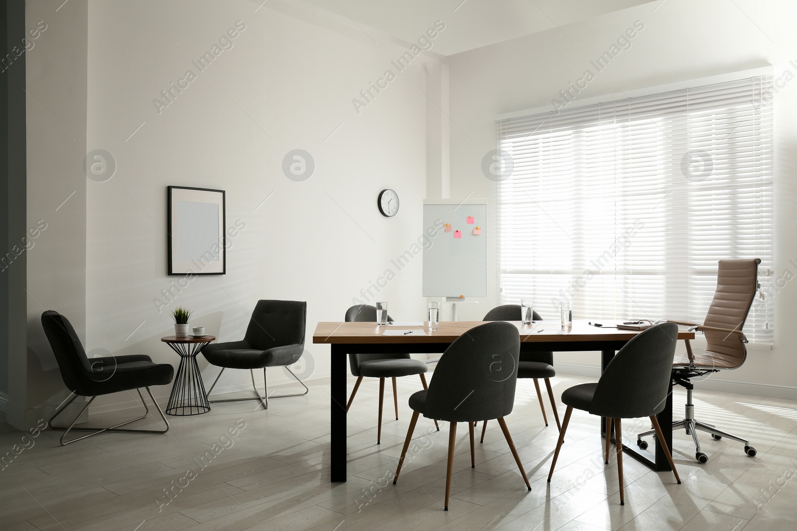 Photo of Simple office interior with large table and chairs