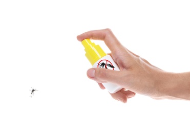 Woman spraying insect repellent on mosquito against white background, closeup