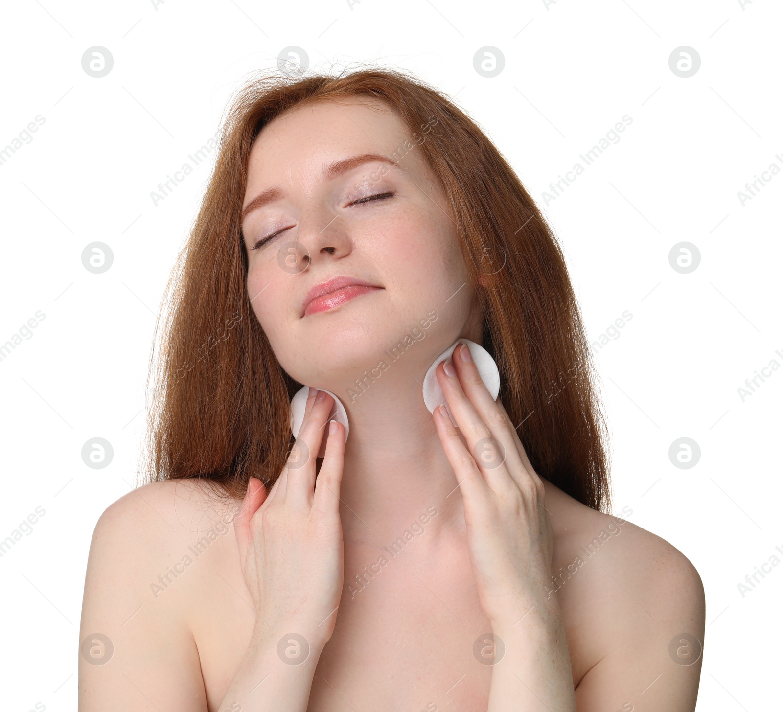 Photo of Beautiful woman with freckles wiping neck on white background