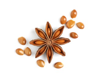 Photo of Dry anise star with seeds on white background, top view