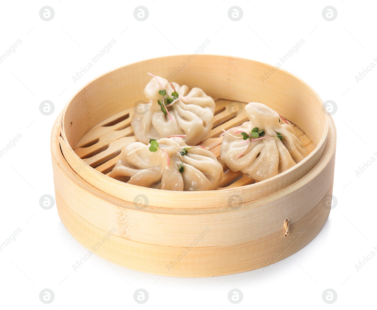 Photo of Bamboo steamer with tasty baozi dumplings on white background