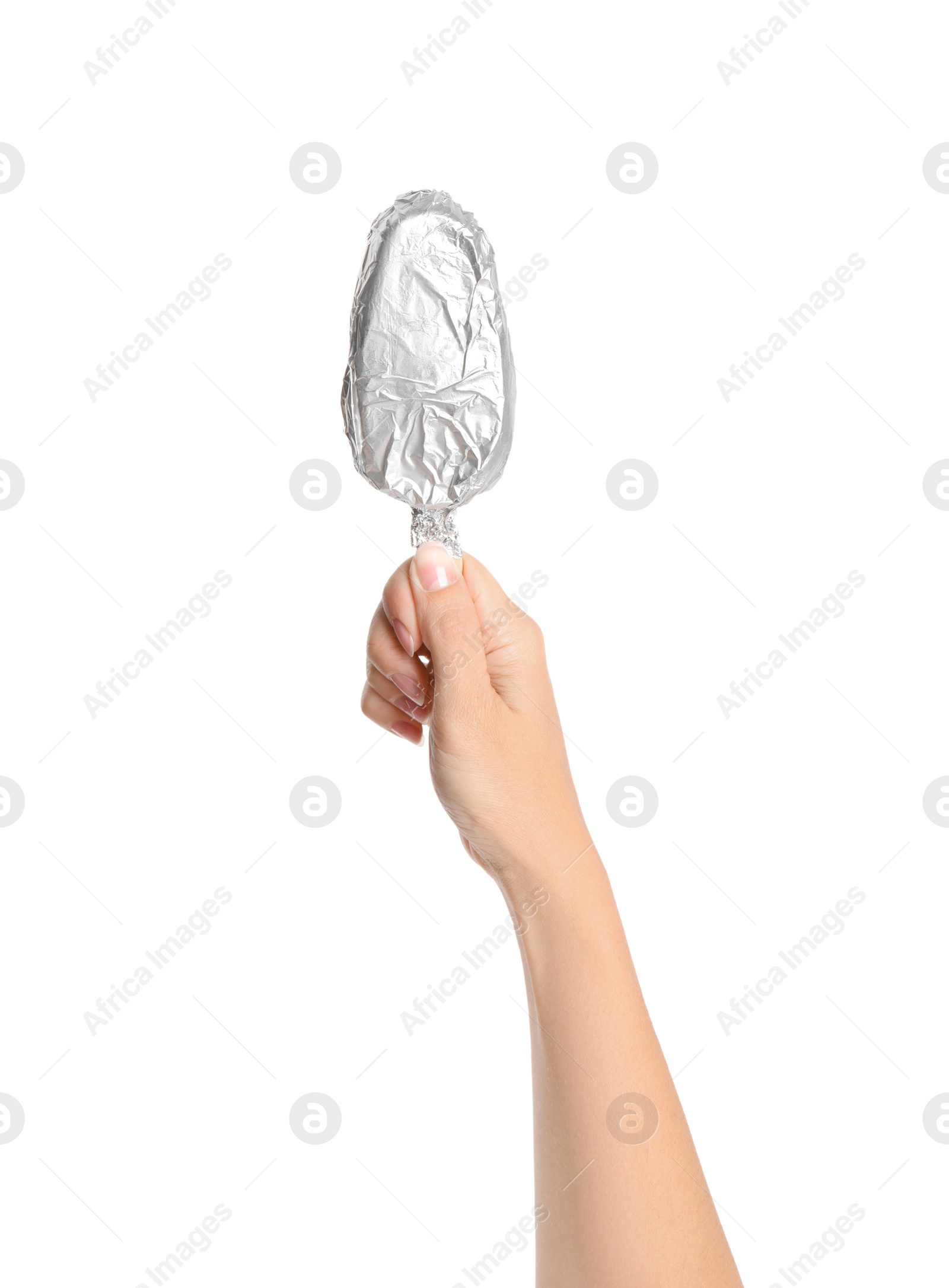 Photo of Woman holding ice cream wrapped in foil on white background, closeup