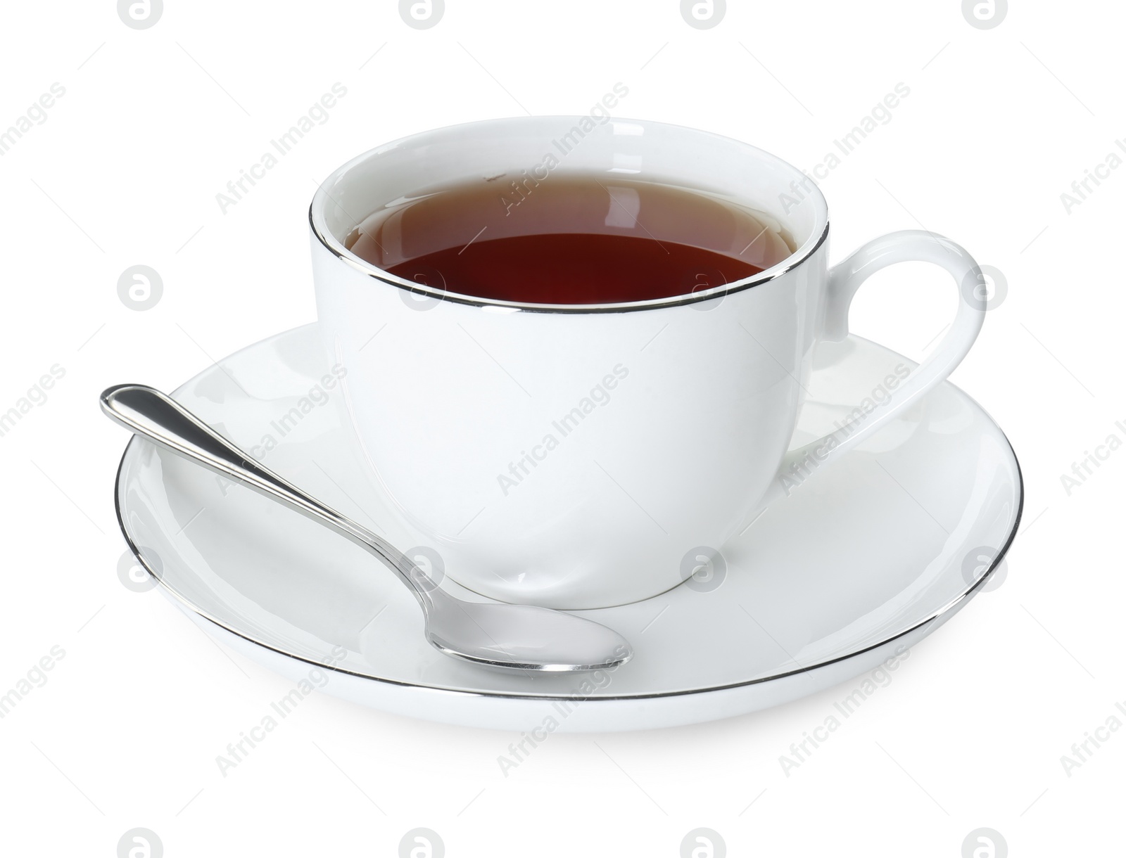 Photo of Aromatic tea in cup and spoon isolated on white