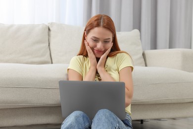 Photo of Woman having video chat via laptop at home