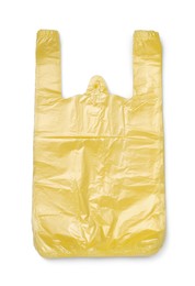 Photo of Stack of yellow plastic bags isolated on white, top view