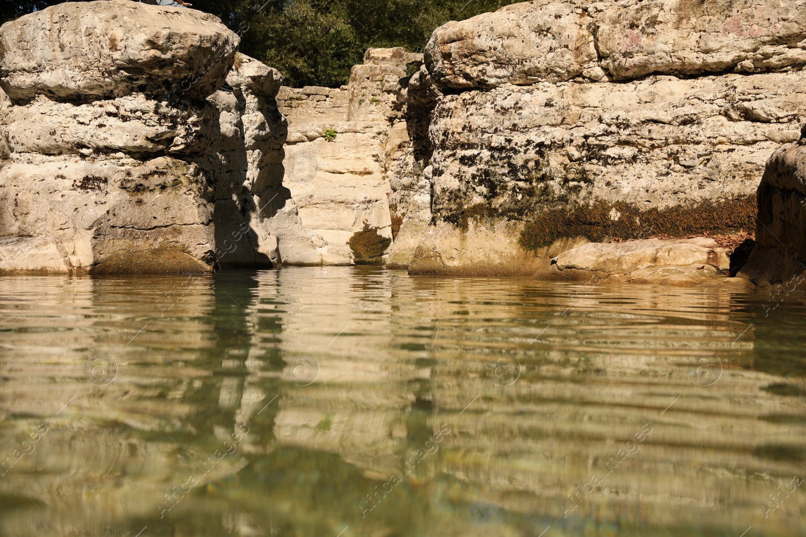 Photo of Beautiful clean pond and many rocks outdoors