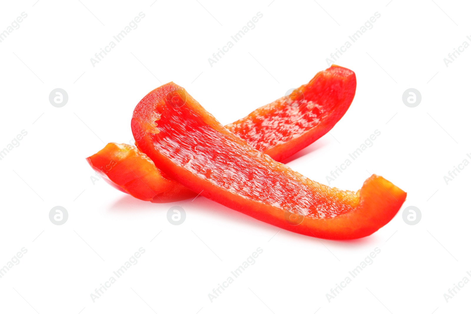 Photo of Slices of ripe red bell pepper on white background