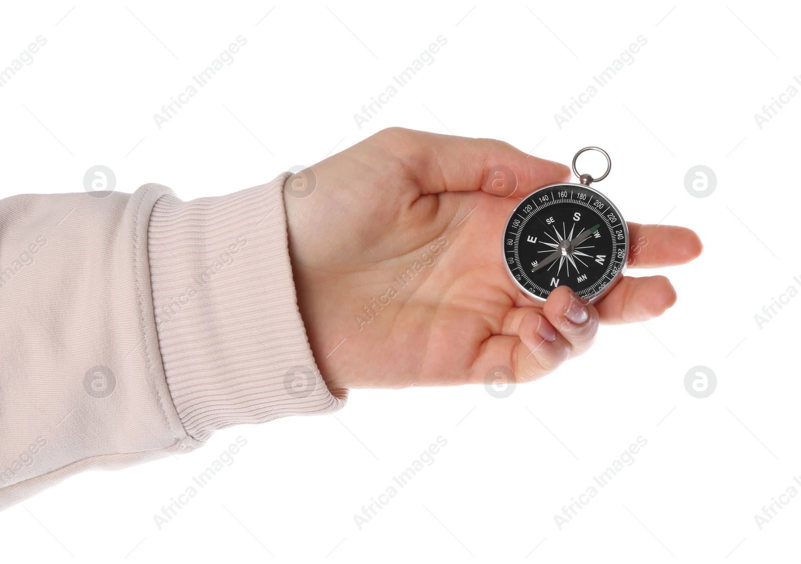 Photo of Woman holding compass on white background, closeup. Tourist equipment