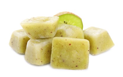 Photo of Frozen kiwi puree cubes and fruit on white background