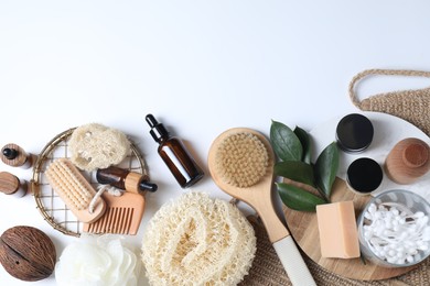 Bath accessories. Flat lay composition with personal care products on white background, space for text