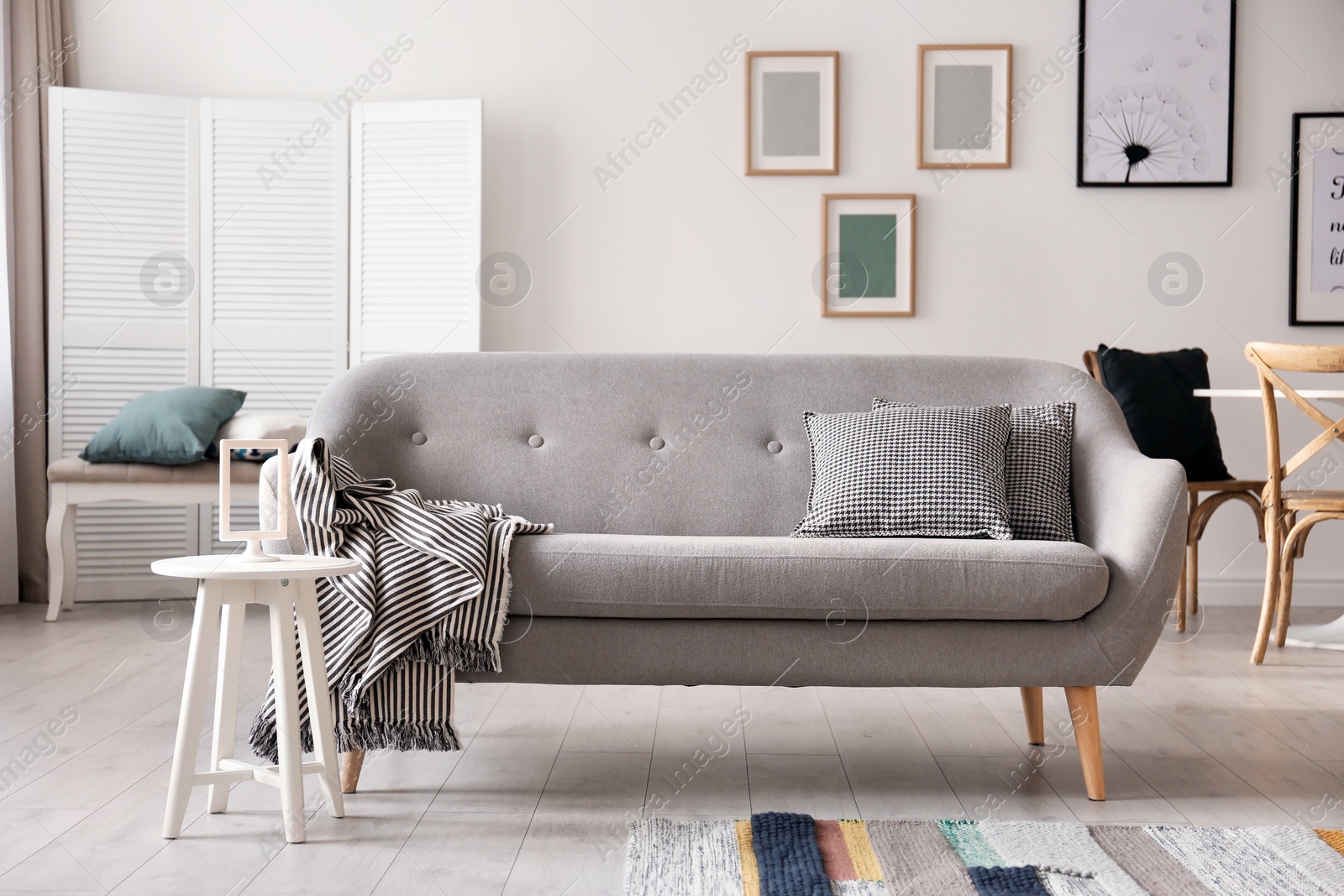 Photo of Cozy living room interior with comfortable sofa