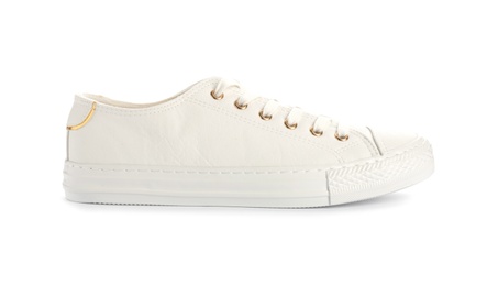 Photo of Stylish sneaker on white background. Trendy footwear