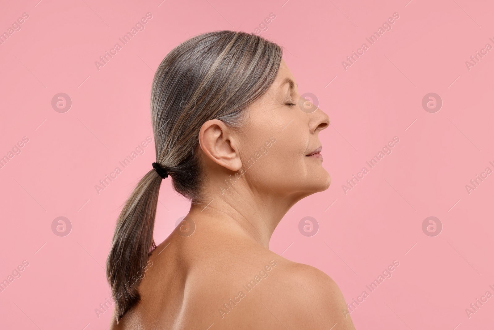 Photo of Beautiful woman with healthy skin on pink background