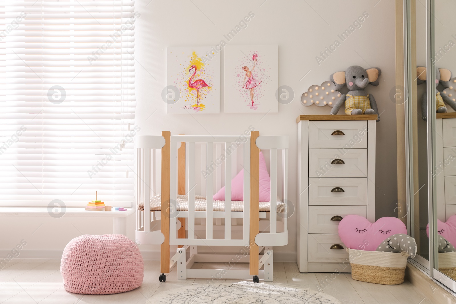 Photo of Baby room interior with beautiful pictures on wall