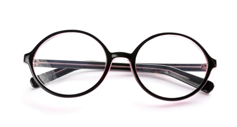 Photo of Glasses with corrective lenses on white background. Vision problem