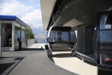 Photo of Modern large cabins on cableway near mountain outdoors