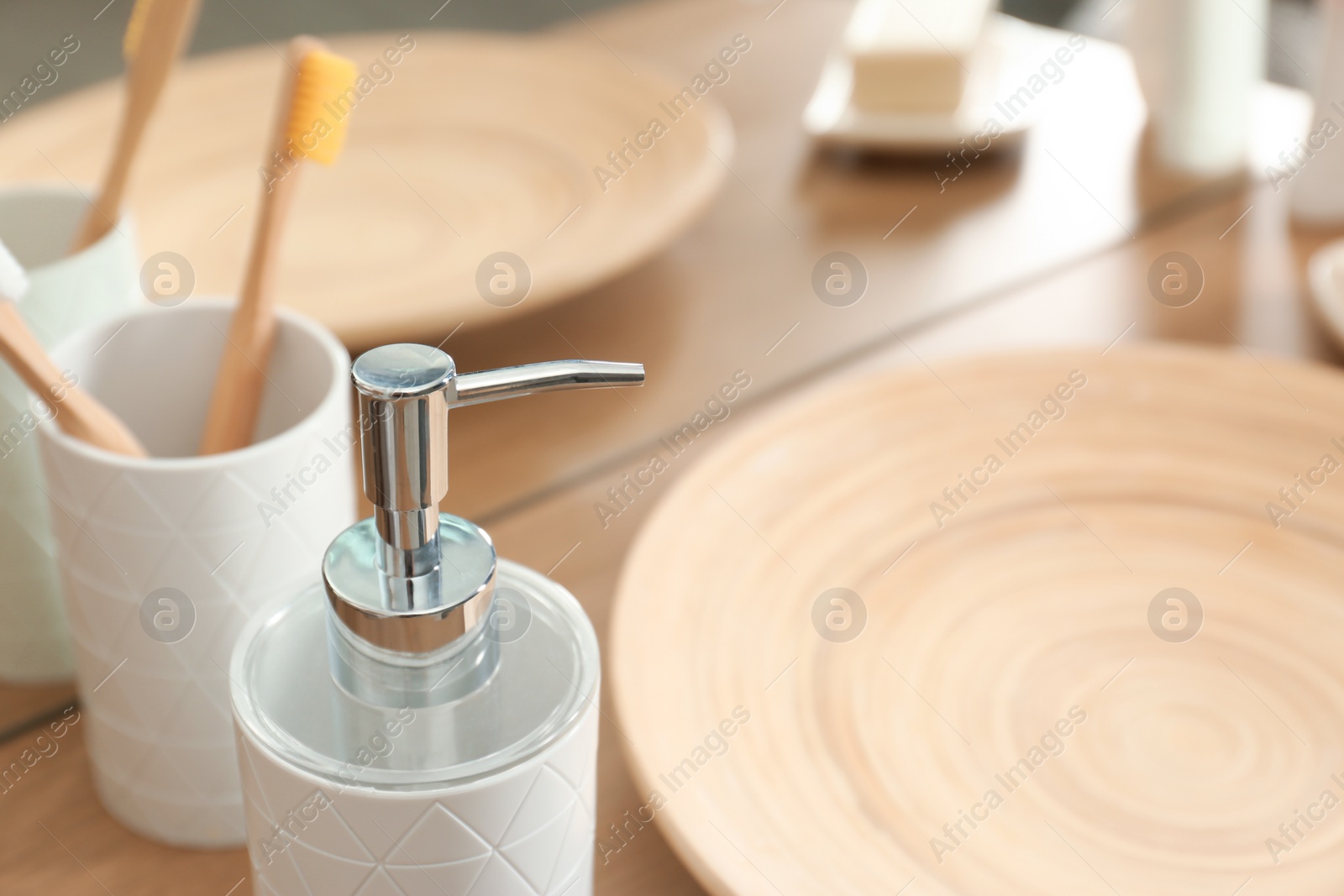 Photo of Bottle with liquid soap on table, closeup. Space for text