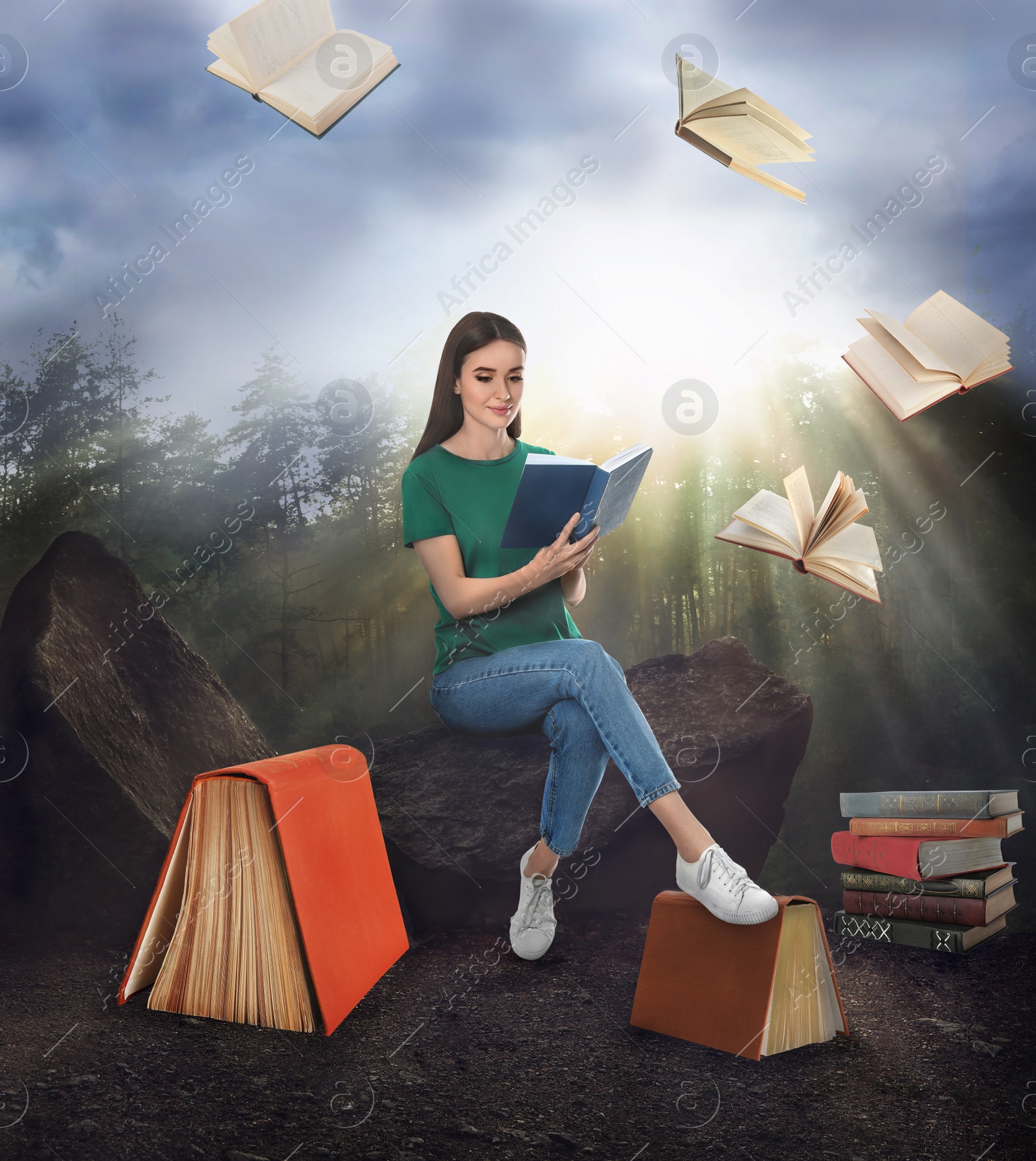 Image of Woman sitting on rock and flying books in sunny forest