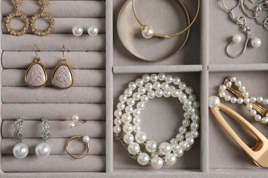 Photo of Box with luxurious pearl jewelry, top view